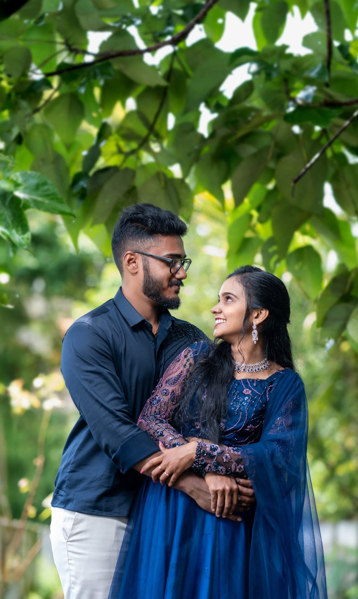 Engaged couple walking together outdoors