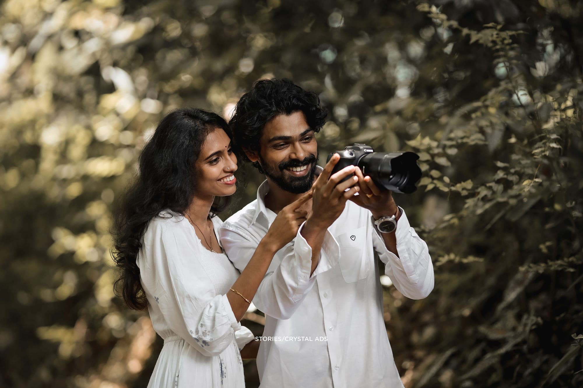 Couple looking at photos on a camera together