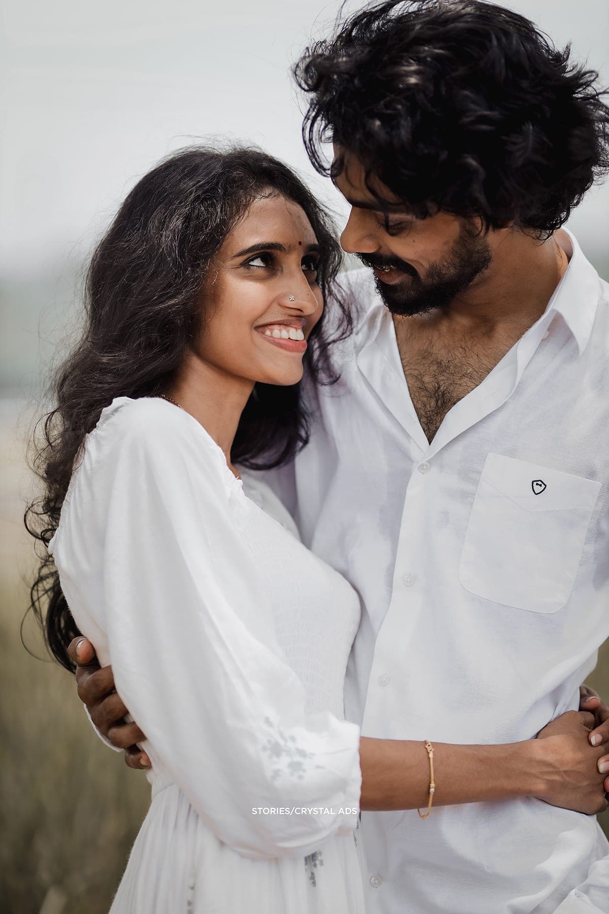 Close portrait of the couple smiling at each other