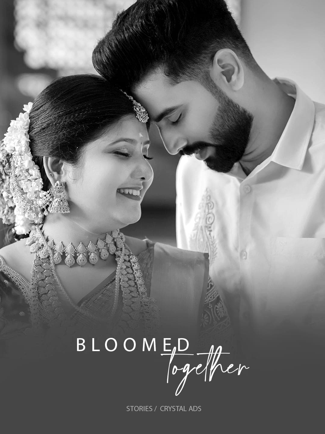 Black and white portrait of bride and groom, foreheads touching