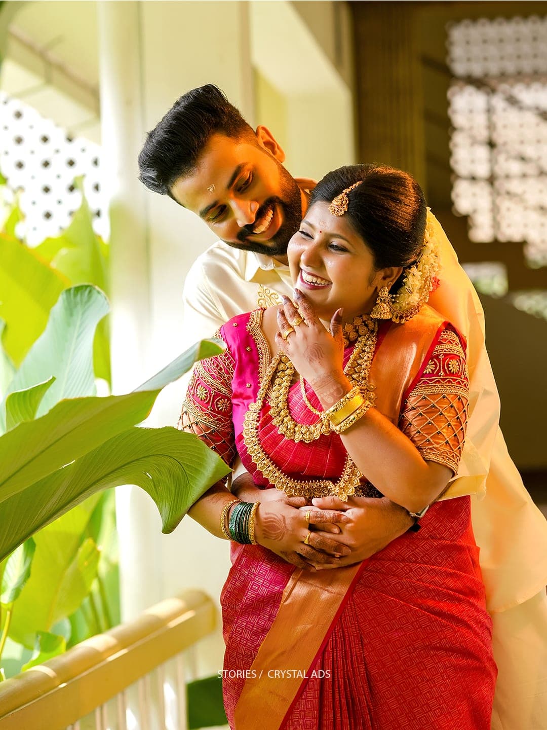 Bride and groom laughing together candidly